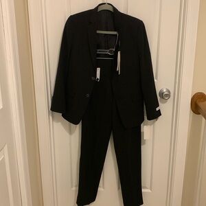 Calvin Klein 2 piece suit slim fit size 14 black new with tags. Jacket and pants